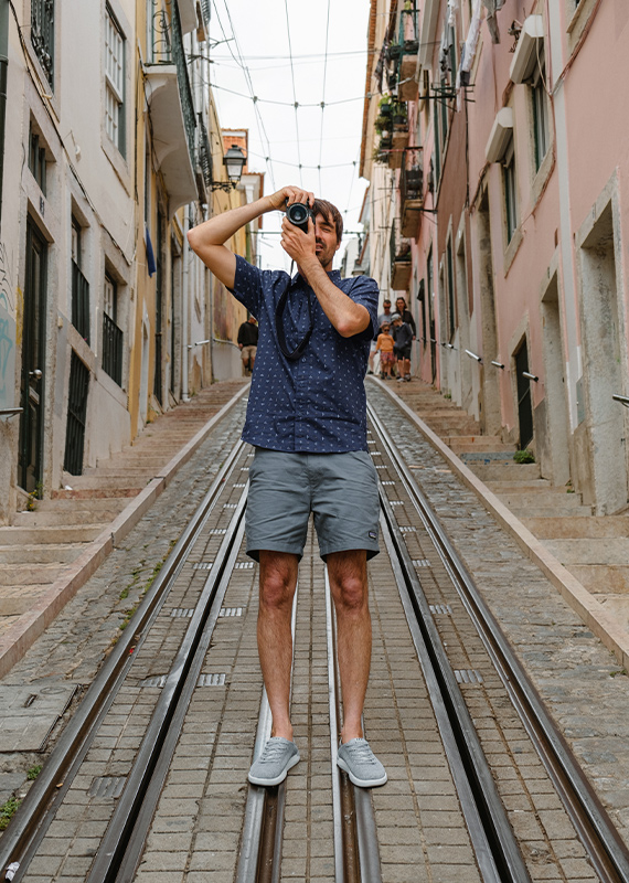 man holding camera portugal